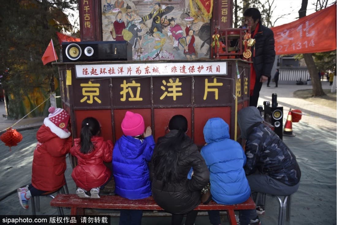 Ditan-style temple fairs combine performances, folk customs, snacks, and the visual language of Spring Festival.