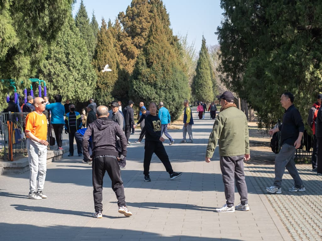 The park side of Temple of Heaven is where Beijing feels social, ordinary, and unexpectedly joyful.
