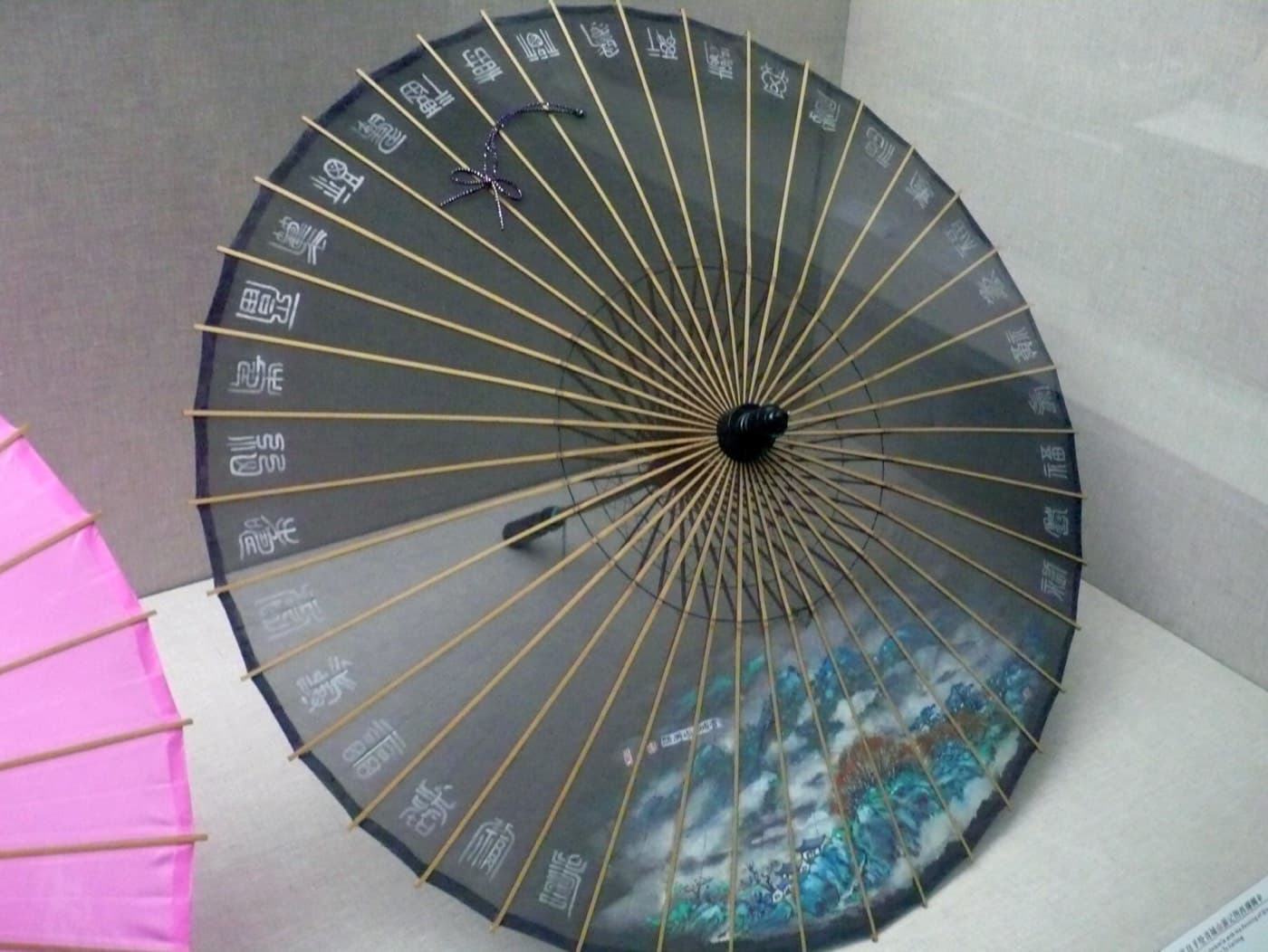 West Lake silk umbrellas are one of the most photogenic examples of Hangzhou craft culture.