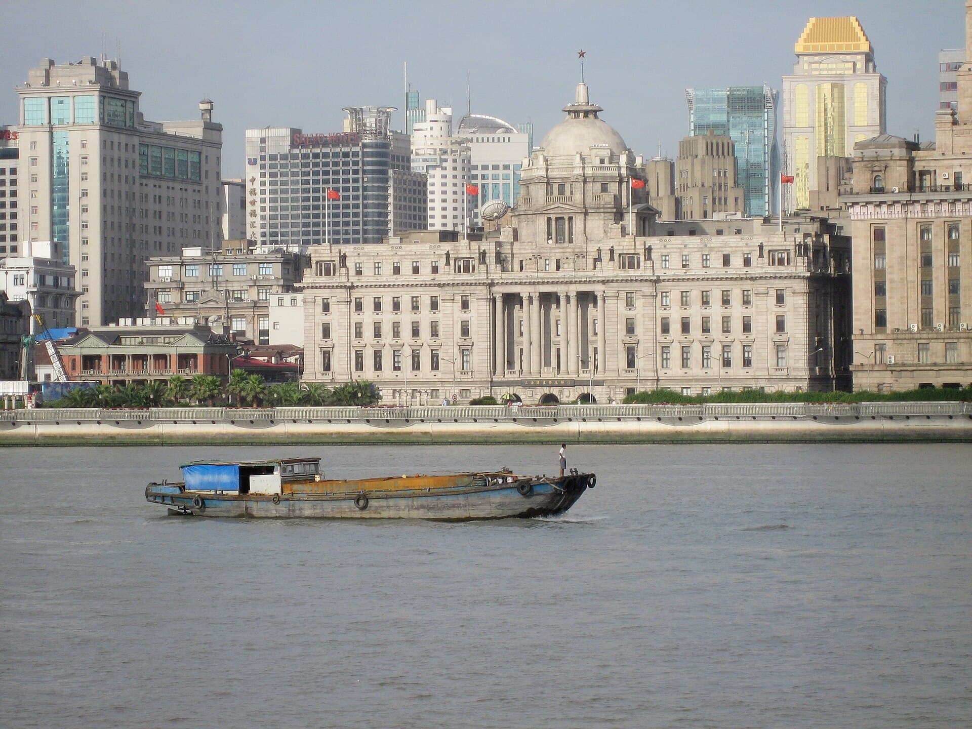 The Bund is the clearest first lesson in Shanghai architecture: old finance-facing-river, modern skyline-facing-back.