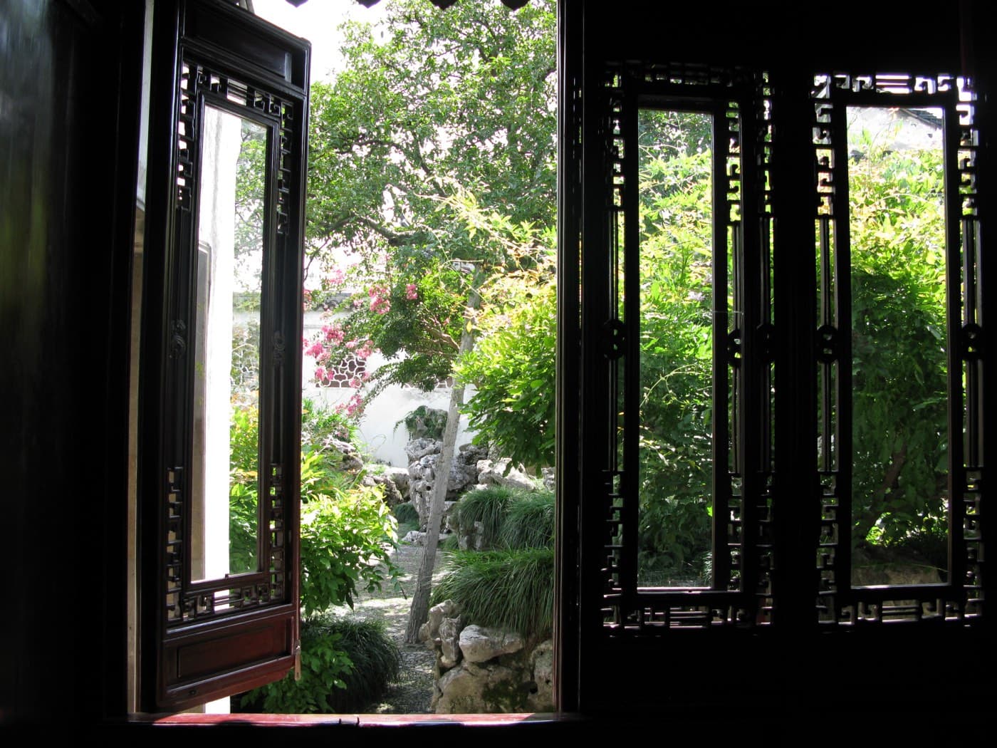 The best garden views often ask you to stop, look through, and look again.