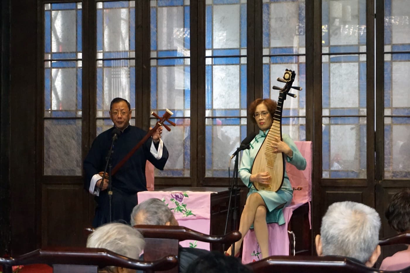 The pipa, sanxian, spoken narration, and singing create Pingtan's room-sized drama.