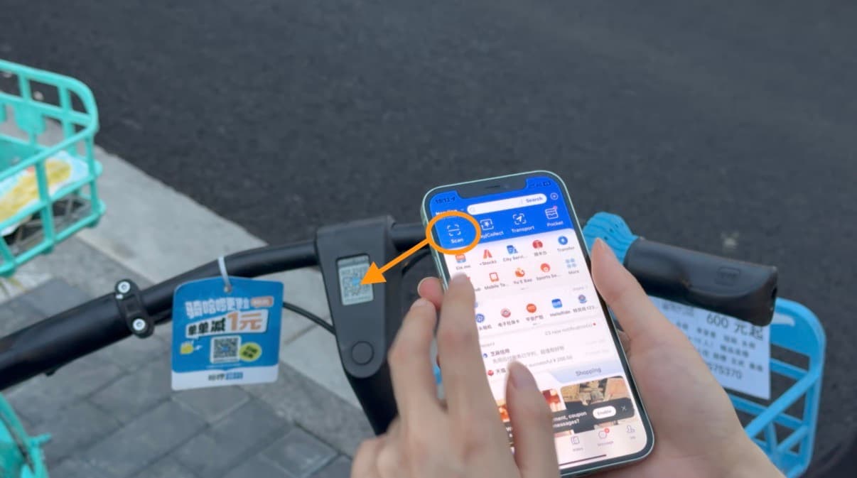 Alipay home screen with Scan highlighted for unlocking a shared bike