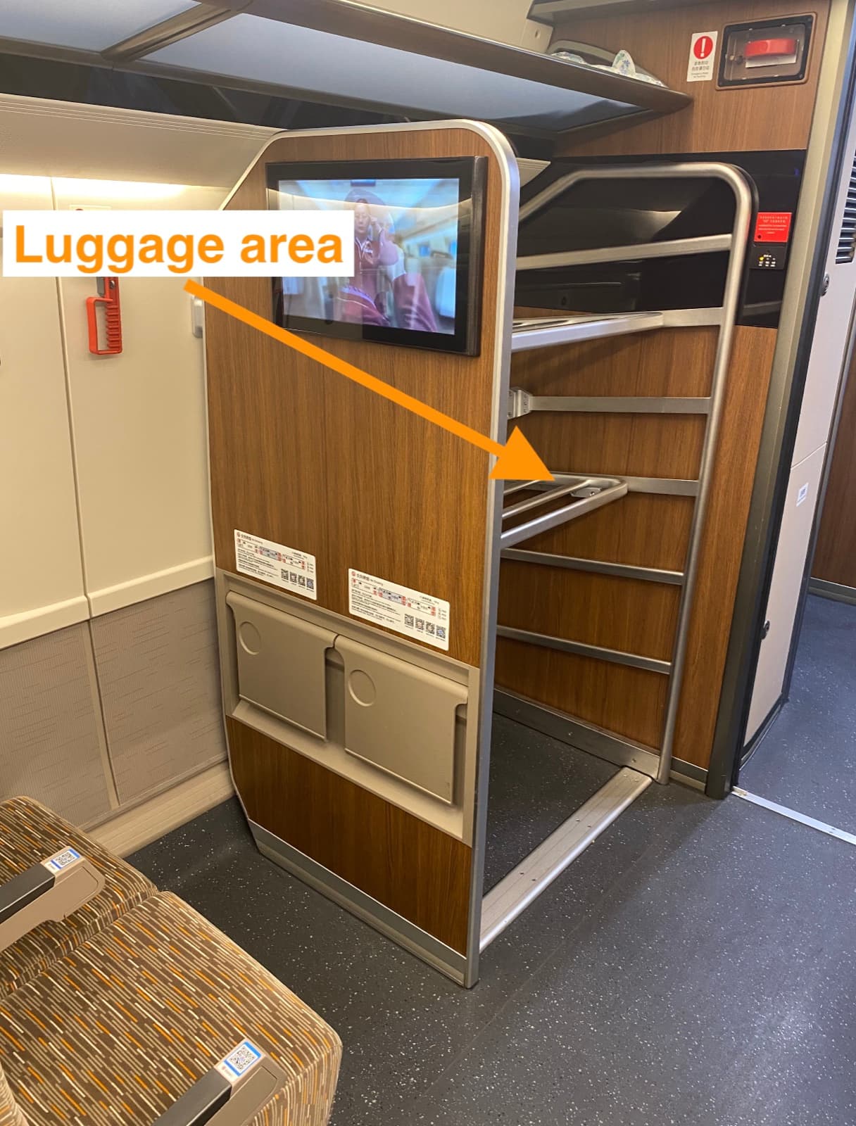 Luggage storage area near the doors inside a Chinese high-speed train carriage