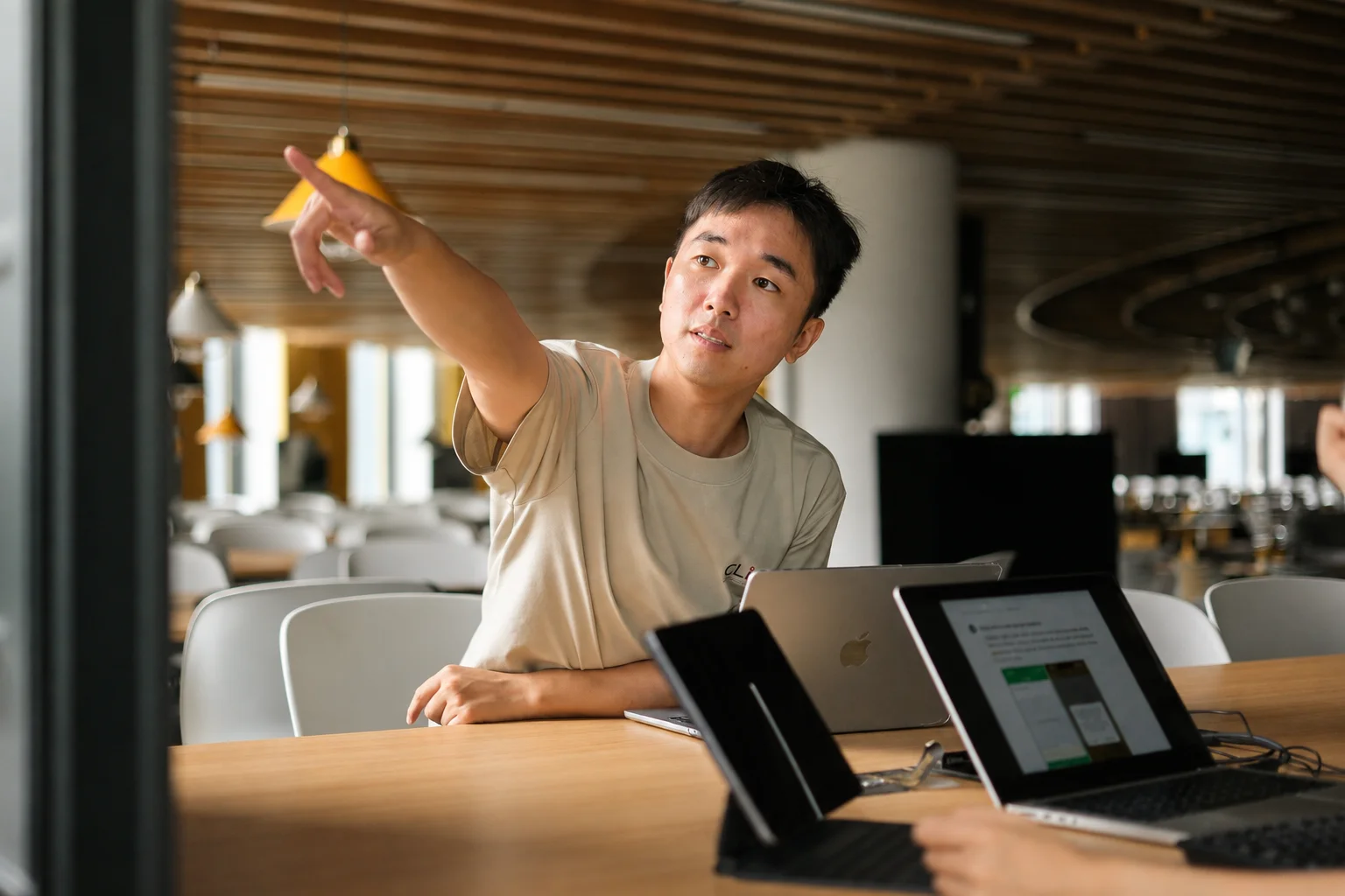 Will talking at a table with a tablet and laptop