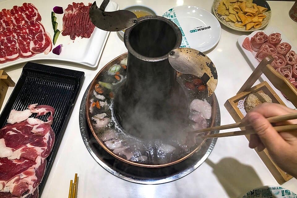 A copper-pot meal after Temple of Heaven turns a formal sightseeing day into a very Beijing dinner.